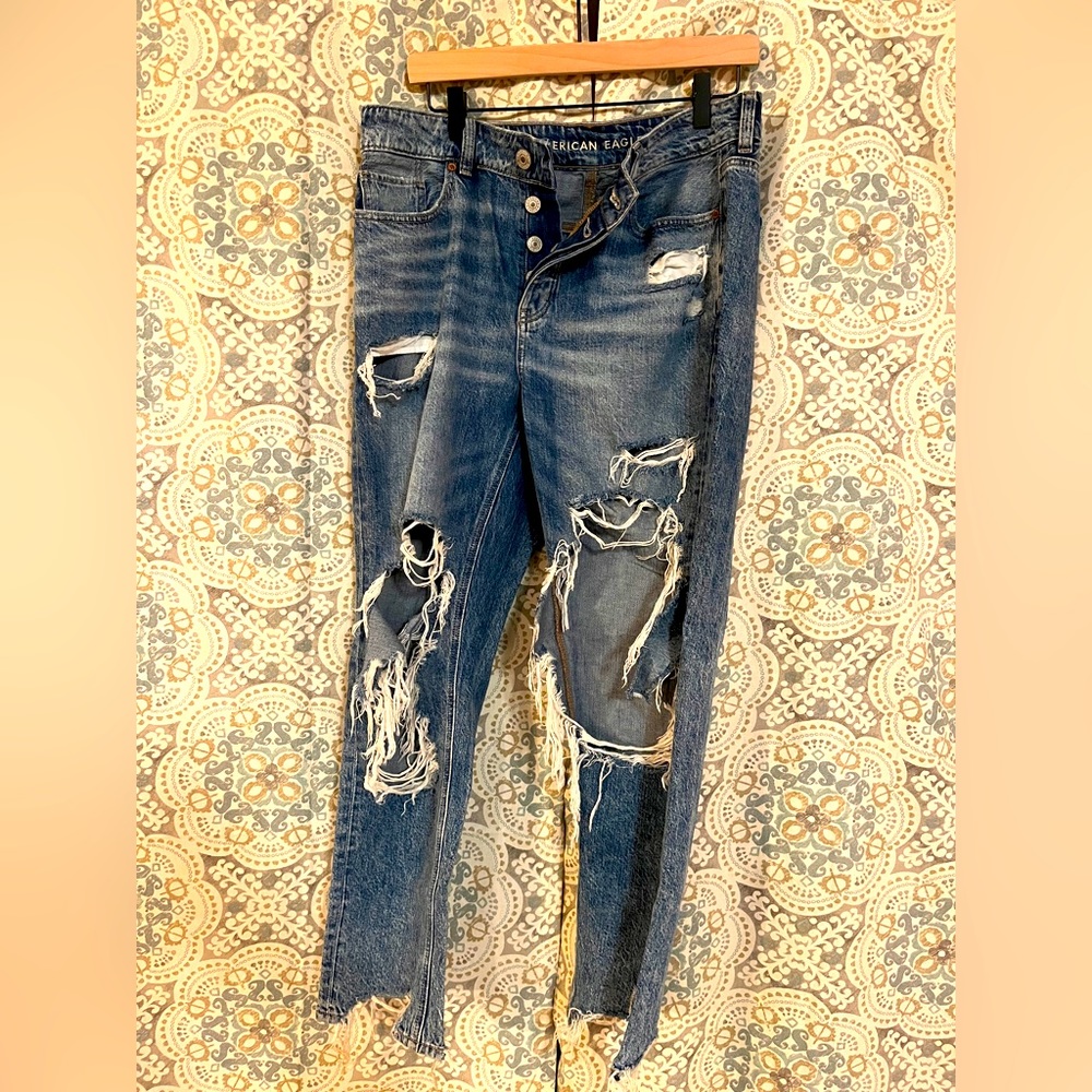 Very distressed Tom girl/loose fit American eagle jeans.